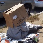 tramp, homeless man in a box